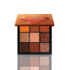 Huda Beauty Topaz Obsessions Eyeshadow Palette showcasing 9 warm-toned shades.